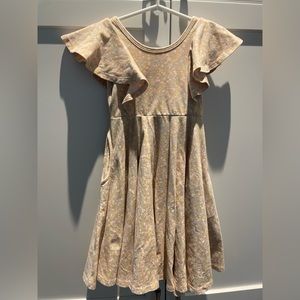 Remie girl flutter sleeve floral apricot colored floral dress with pockets.